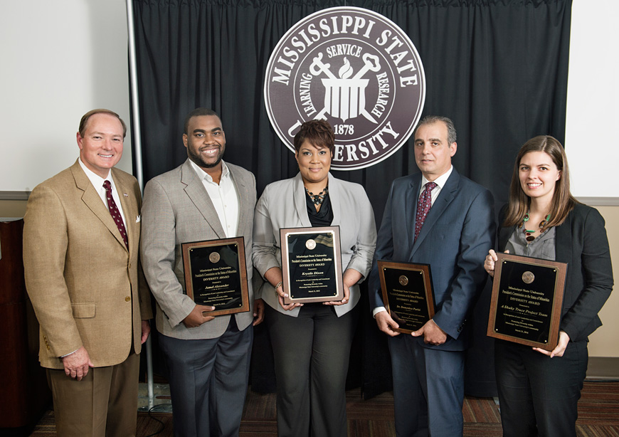 President Mark E. Keenum (far left) congratulates 2016 MSU Diversity Award winners, including (from left) Jamel Alexander, Krystle Dixon, Domenico “Mimmo” Parisi and Hillary Richardson. Richardson accepted on behalf of faculty and students with the “A Shaky Truce: Starkville Civil Rights Struggles, 1960-1980” Project. (Photo by Megan Bean)